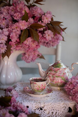 Beautiful bouquet pink flowers. lilac flowers. cherry flowers in vase .