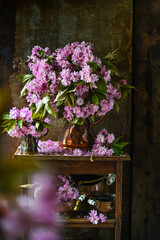 Fototapeta na wymiar Beautiful bouquet pink flowers. lilac flowers. cherry flowers in vase .