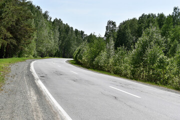 Fototapeta na wymiar High speed asphalt road highway in the afternoon in the forest