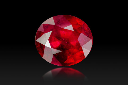 red crystal of natural origin. close up of crystals in ruby color on black  background Stock Photo