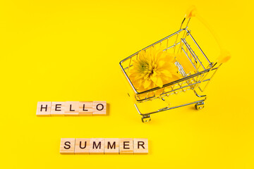 Hello summer. Colorful flowers on yellow background. Vacation and seasonal shopping concept.
