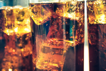 Refreshing Bubbly Soda Pop with Ice Cubes. Cold soda iced drink in a glasses - Selective focus, shallow DOF	
