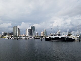 Fototapeta na wymiar Boats in a marina near downtown buildings