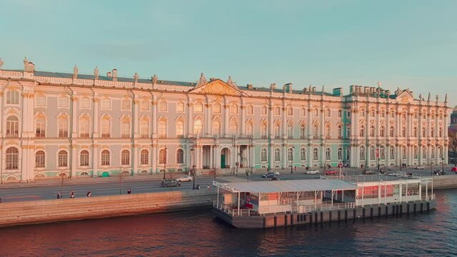 Aerial view of Incredibly beautiful Dvortsovaya Embankment in the center of St. Petersburg on the sunset, the well-known museum Hermitage, St. Isaac's Cathedral on a background, the Admiralty building