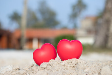 Fototapeta premium Romantic love symbol two red heart on the paradise tropical beach with copy space. Valentine day and Marry Concept.