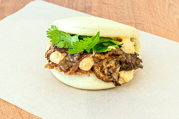 Bao Asian bread sandwich stuffed with Iberian pork cheek