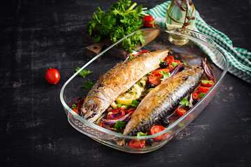 Baked mackerel with herbs and lemon and  vegetables. Healthy dinner.