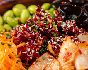 Closeup on hawaiian spicy chicken poke bowl with kimchi 