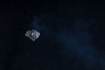 flying asteroid meteorite in black space