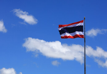 3 red blue white Thai realistic flag . Thai wavy aginst blue sky patriotic symbol