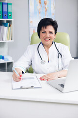 Fototapeta na wymiar Confident woman wear white medical coat with stethoscope looking at camera. Happy lady professional medic clinic staff female nurse or doctor posing for close up portrait