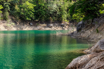 A view of the natural Lake Tsivilu (Peloponnesus, Greece) and mountains around on a sunny, summer day