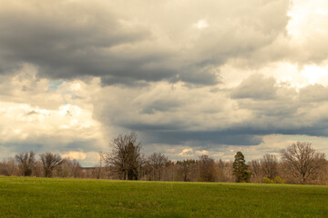 Fototapeta premium A sunny spring day with beautiful dramatic clouds
