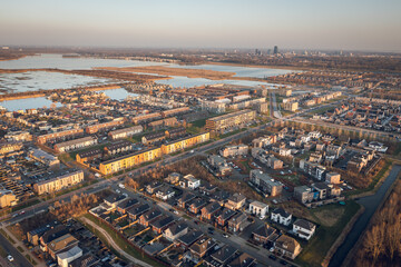 Fototapeta na wymiar Modern residential neighborhood in Almere, Flevoland, The Netherlands, surrounded by nature. Aerial view. 