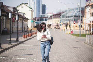 A beautiful young brunette hipster girl on the street of her city