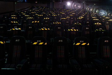 The black marked seats of the cinema auditorium