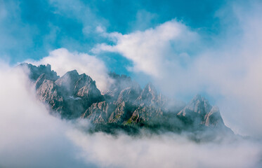 Clouds over mountain peaks in the Dolomites, Italy.