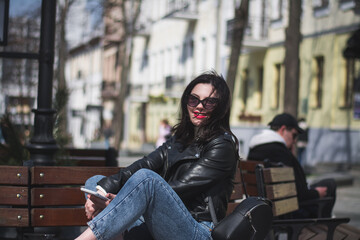 A beautiful young brunette hipster girl on the street of her city