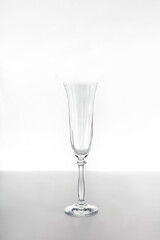 Empty glass flute glass on a white background