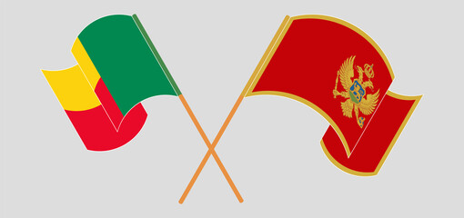 Crossed and waving flags of Benin and Montenegro