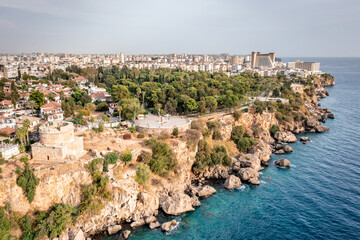 Fototapeta na wymiar Panoramic photo of Antalya, Turkey. View from the sea to the Mediterranean coast and cityscape