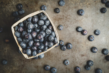 Fresh blueberries on a dark surface