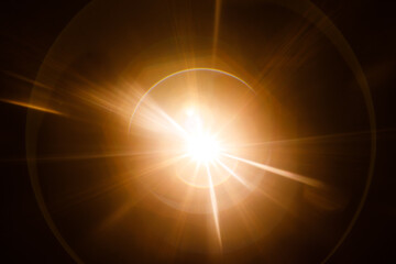 Easy to add lens flare effects for overlay designs or screen blending mode to make high-quality images. Abstract sun burst, digital flare, iridescent glare over black background.