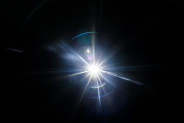 Easy to add lens flare effects for overlay designs or screen blending mode to make high-quality images. Abstract sun burst, digital flare, iridescent glare over black background.