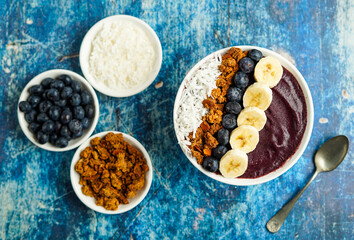 Blueberry smoothie bowl with granola and fresh fruit