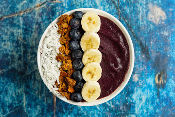 Blueberry smoothie bowl with granola and fresh fruit