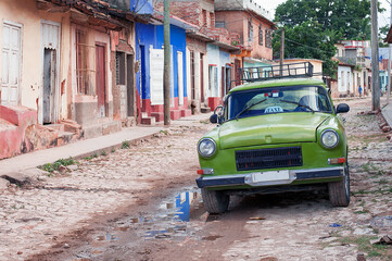 taxi car on the cobblestone road of an authentic town on the Caribbean coast