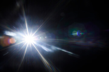 Easy to add lens flare effects for overlay designs or screen blending mode to make high-quality images. Abstract sun burst, digital flare, iridescent glare over black background.