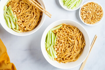 Sesame noodles with chopped peanuts and fresh cucumber