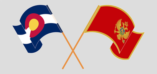 Crossed and waving flags of The State of Colorado and Montenegro