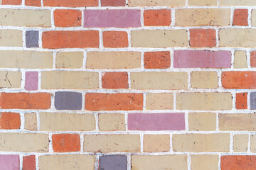 Brick wall, masonry of bricks of different colors, background.