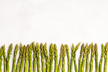 Fresh asparagus on a white backgroun