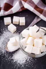 sugar refined on a dark stone background