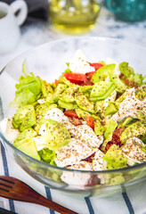 Salad with avocado, cucumber, cherry tomatoes and lettuce. Symbolic image. Concept for healthy nutrition. Close up