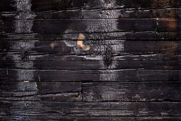 Burnt wooden Board texture. Burned scratched hardwood surface. Charred board