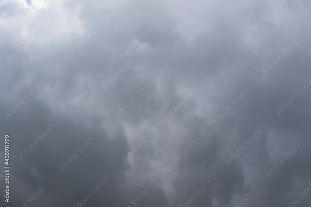 Wall mural stormy dark clouds in the sky