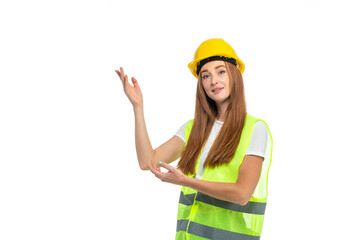 Young beautiful woman with red hair in helmet at studio