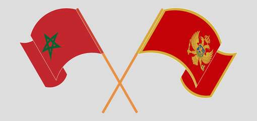 Crossed and waving flags of Morocco and Montenegro