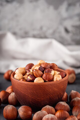 fresh natural hazelnuts on a dark stone background