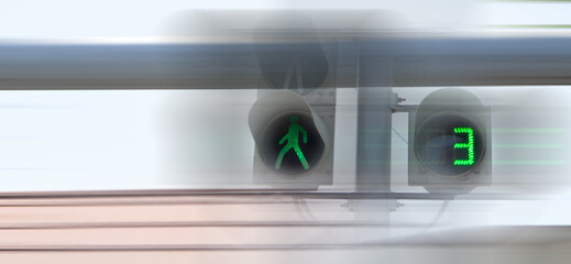 the traffic light is green for pedestrians