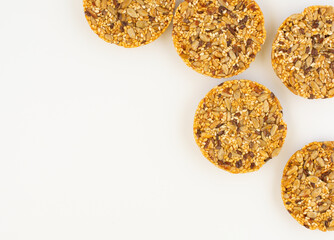 round kozinaki of sunflower seeds isolated on white background. top view. space for text.
