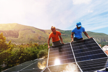 Workers assemble energy system with solar panel for electricity