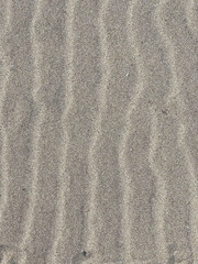 Sand texture close up image grey beige sand 