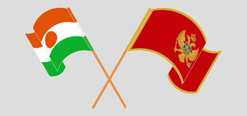 Crossed and waving flags of Niger and Montenegro