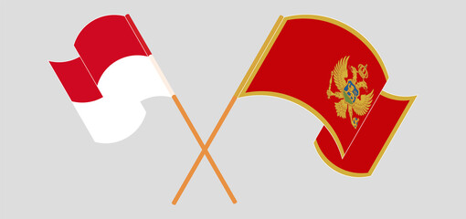 Crossed and waving flags of Monaco and Montenegro