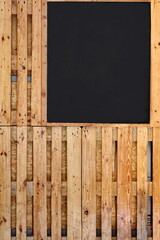 Closeup of Blank Menu Blackboard Hanging in Pub or Bar Interior On Grunge Wall. Mock up. Empty Chalkboard Menu Sign Mockup Isolated On Wood Wall Background.